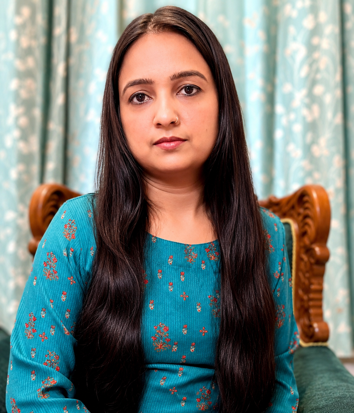 formal portrait with teal backdrop